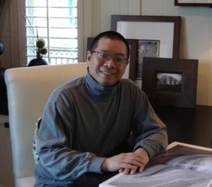 Calvin Lee at Desk smiling ss DSC01401